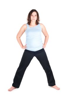 Portrait of pretty pregnant woman practicing physical exercise isolated on white