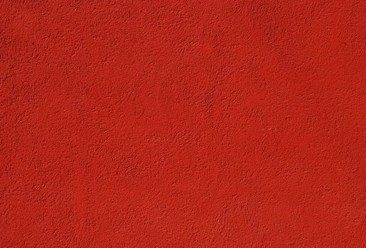 Red painted plastered house wall as background