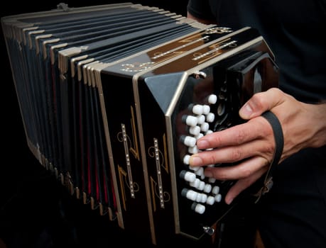 Playing the bandoneon, traditional tango instrument, Argentina.