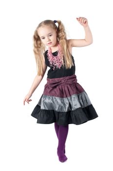 Studio portrait of little cute girl in beautiful dress