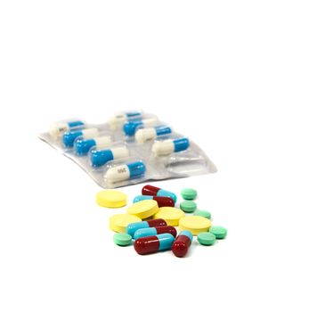 Medical pills and tablets isolated on white background.