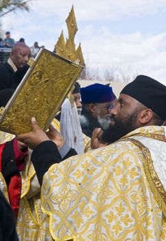 QASER EL YAHUD , ISRAEL - JAN 19 : Ethiopian Orthodox priest participates in the annual baptising ceremony during the epiphany at Qaser el yahud , Israel in January 19 2012