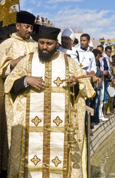 QASER EL YAHUD , ISRAEL - JAN 19 : Ethiopian Orthodox priests participates in the annual baptising ceremony during the epiphany at Qaser el yahud , Israel in January 19 2012