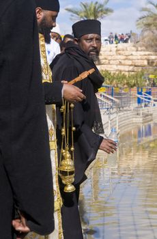 QASER EL YAHUD , ISRAEL - JAN 19 : Ethiopian Orthodox priest participates in the annual baptising ceremony during the epiphany at Qaser el yahud , Israel in January 19 2012