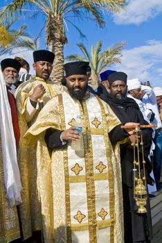 QASER EL YAHUD , ISRAEL - JAN 19 : Ethiopian Orthodox priests participates in the annual baptising ceremony during the epiphany at Qaser el yahud , Israel in January 19 2012