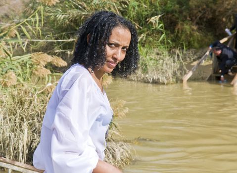 QASER EL YAHUD , ISRAEL - JAN 19 : Unidentified Ethiopian orthodox Christian woman  participates in the baptising ritual during the epiphany at Qaser el yahud , Israel in January 19 2012