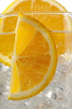 cropped image of orange slices with ice cubes