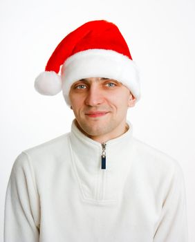 young man in a white jacket and Santa hat. portrait