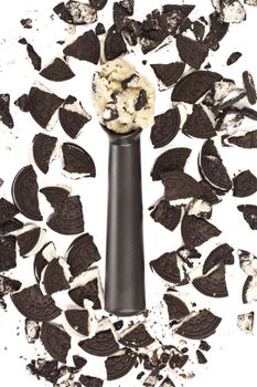 ice cream scoop and chocolate cookies on a white background