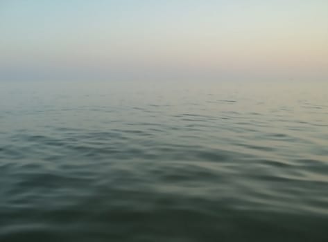                  Sea landscape: overview calm sea with a blurred horizon              