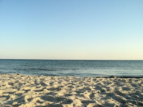           Seascape: general view of the desert of sandy beach and the sea                     