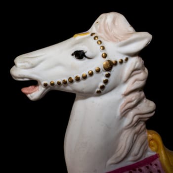Colorful carousel horse isolated on black background