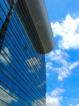 Modern office building and blue sky reflection