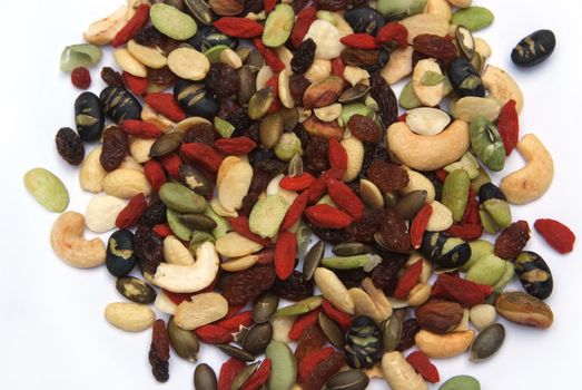 organic mixed nuts and dry fruits on white background