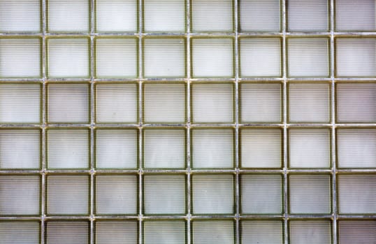 Large wall of ribbed glass brick on an urban home