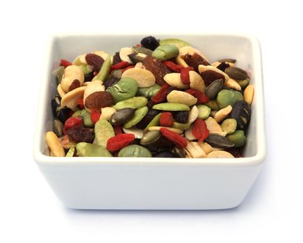 organic mixed nuts and dry fruits on white background