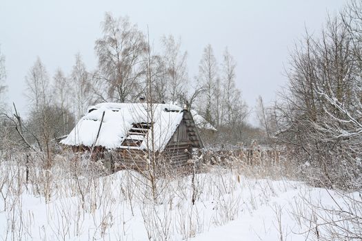 old rural house amongst white snow