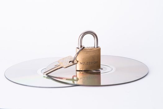Computer disk and lock isolated on white background