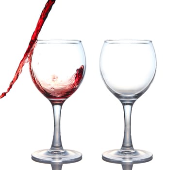 red wine pouring into glass isolated on white background 