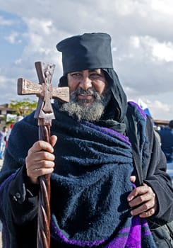 QASER EL YAHUD , ISRAEL - JAN 19 : Ethiopian Orthodox priest participates in the annual baptising ceremony during the epiphany at Qaser el yahud , Israel in January 19 2012