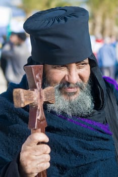 QASER EL YAHUD , ISRAEL - JAN 19 : Ethiopian Orthodox priest participates in the annual baptising ceremony during the epiphany at Qaser el yahud , Israel in January 19 2012