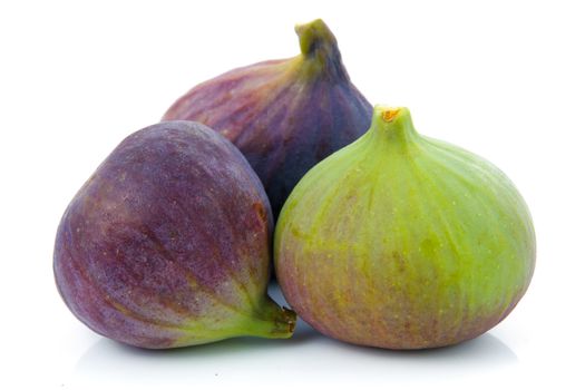 Ripe purple and green fig fruit isolated on white background 