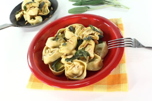 fresh stuffed tortellini with sage butter and pine nuts