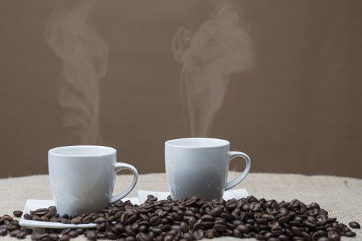 Still life about coffee with cups and beans