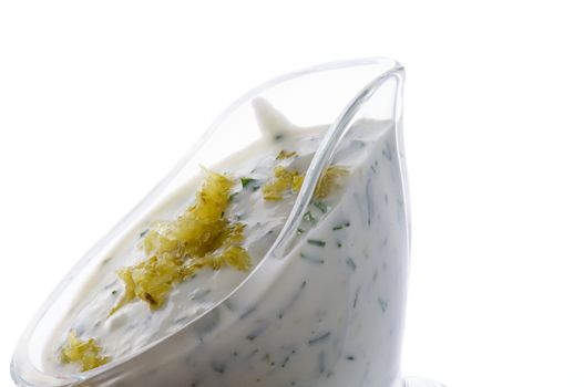 Tartar Sauce in Glass Gravy Boat close up isolated on white background