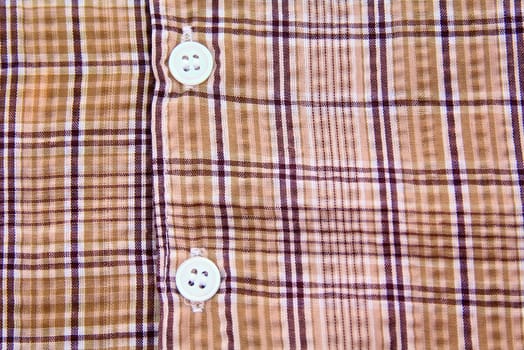 A part of a shirt with buttons