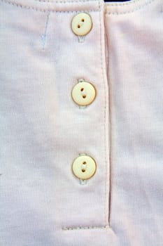 A part of a shirt with buttons