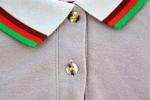 A part of a shirt with buttons