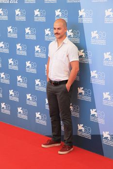 Marc Andre Grondin poses for photographers at 69th Venice Film Festival