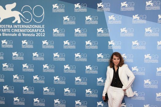 Noomi Rapace poses for photographers at 69th Venice Film Festival