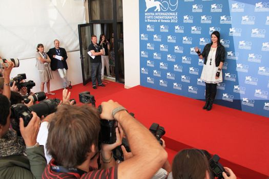 Alex Schmidt poses for photographers at 69th Venice Film Festival