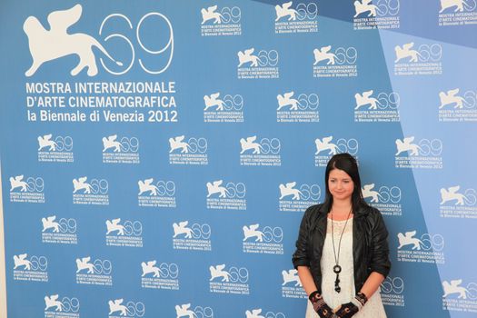 Alex Schmidt poses for photographers at 69th Venice Film Festival