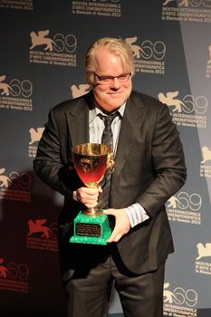 Philip Seymour Hoffman poses for photographers at 69th Venice Film Festival