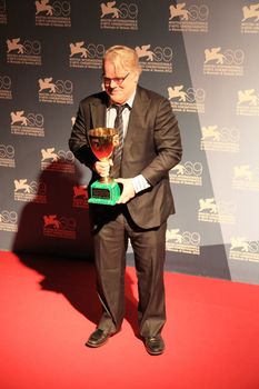 Philip Seymour Hoffman poses for photographers at 69th Venice Film Festival
