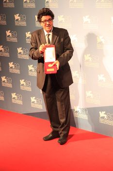 Daniele Ciprì poses for photographers at Venice Film Festival