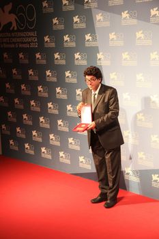 Daniele Ciprì poses for photographers at Venice Film Festival