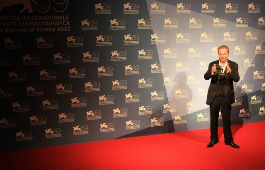 Ulrich Seidl poses for photographers at Venice Film Festival