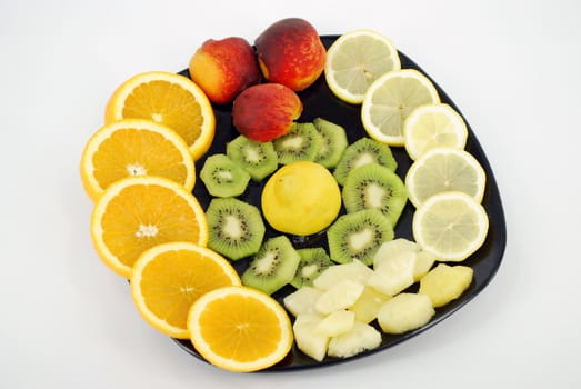 Fresh fruit on black dish