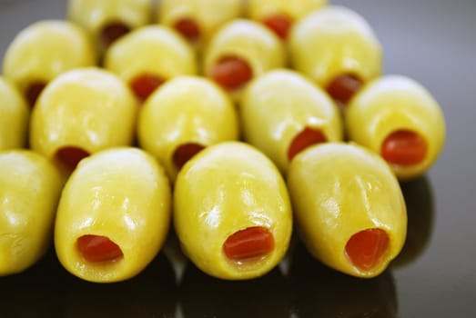 Olives with peppers close detail
