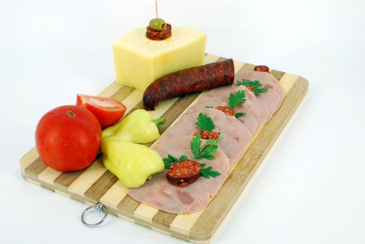 Breakfast with sausage salami cheese and vegetables