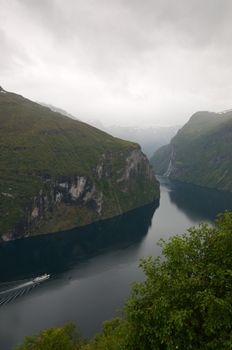 Landmark view Geiranger fjord Norway on a rainy day.