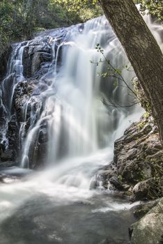 Cascades on a mountain river with a silky effect on the water that conveys a sense of relaxation.