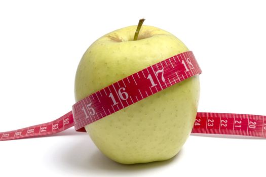 Apple diet.Green apple and tape measure