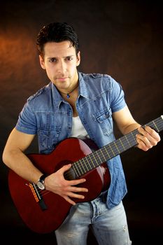 Serious male model with guitar