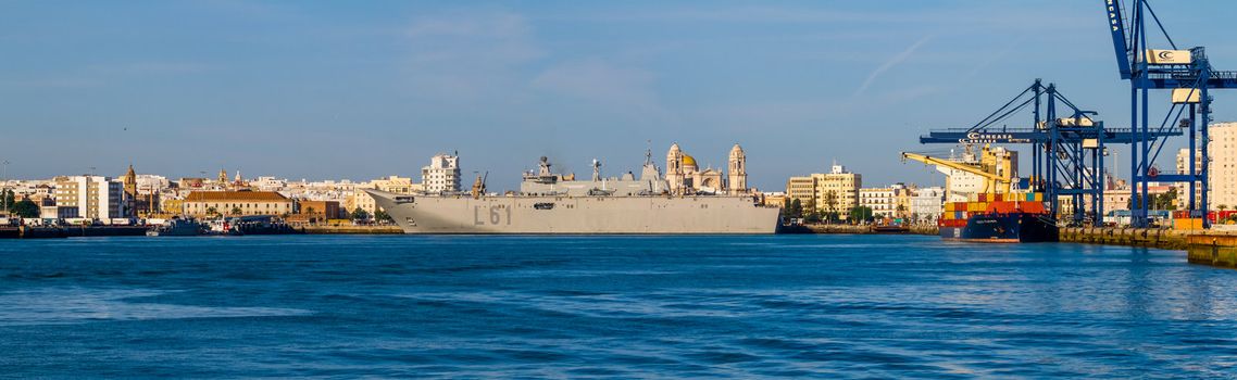 CADIZ, SPAIN-JUN 04: Aircraft carrier L-61 Juan Carlos I setting sail after taking part in an exhibition on the day of the spanish army forces on Jun 04, 2012, in Cadiz, Spain