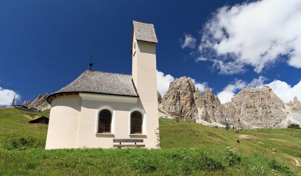 small chapel beneath Cir Dolomites in Gardena pass, Italy